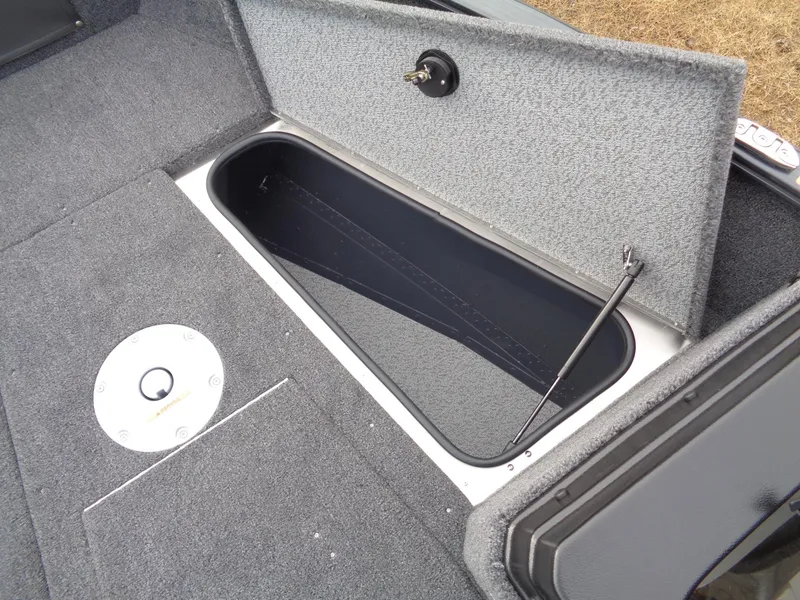 Slide: The Image of Open storage compartment in 2025 Lund 1775 Adventure SS boat interior. - 32