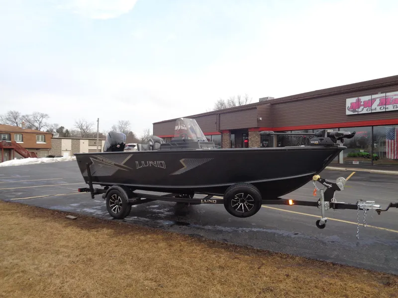 Slide: The Image of 2025 Lund 1775 Adventure SS boat on trailer in parking lot. - 36