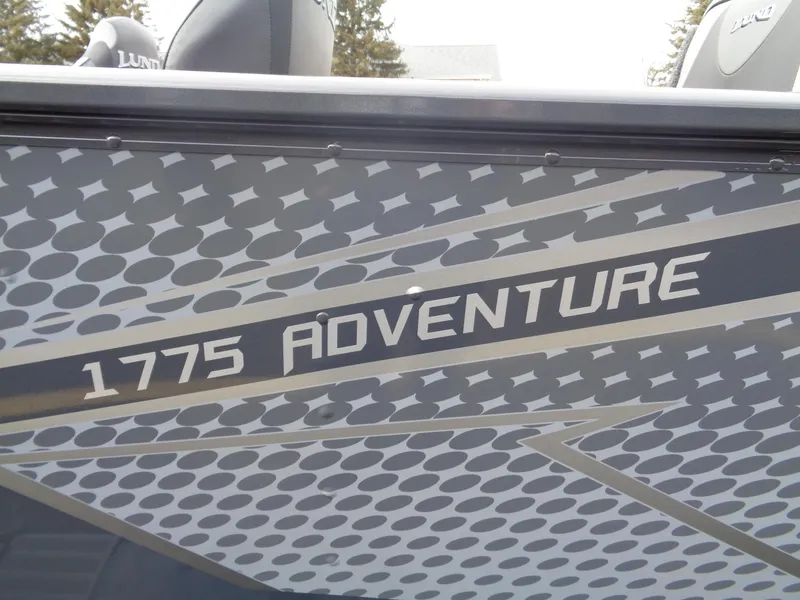 Slide: The Image of 2025 Lund 1775 Adventure SS boat with sleek graphic design. - 8