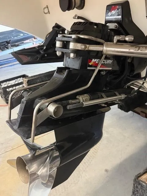 Slide: The Image of Outboard motor of a 2000 Fountain 27 Fever boat with Mercury branding. - 14