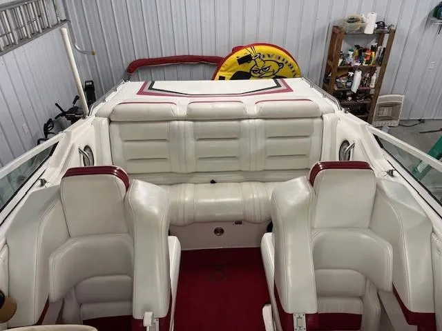 Slide: The Image of Interior of 2000 Fountain 27 Fever boat with white and red seating. - 4