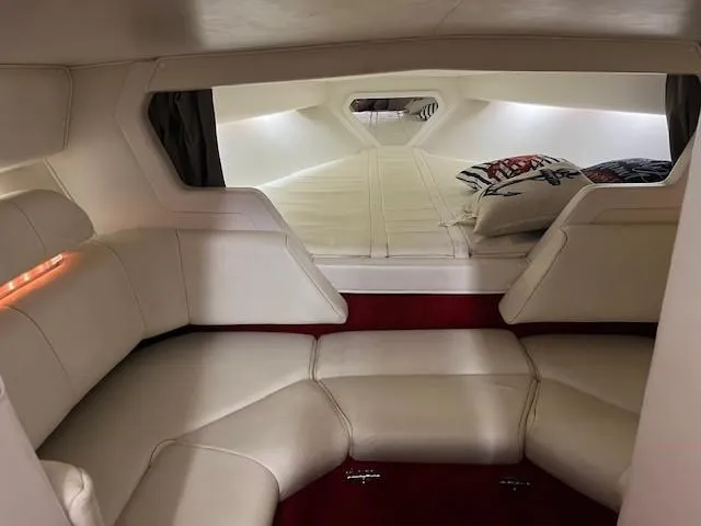 Slide: The Image of Interior of 2000 Fountain 27 Fever boat with white seating and red carpet. - 5