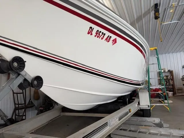 Slide: The Image of 2000 Fountain 27 Fever boat on trailer in storage facility. - 7