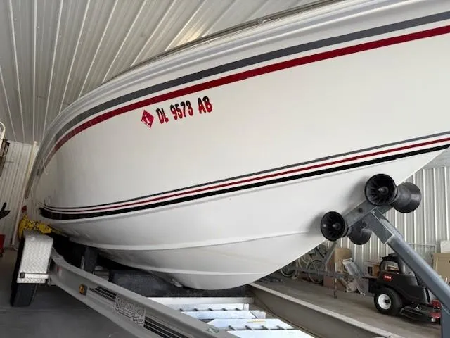 Slide: The Image of 2000 Fountain 27 Fever boat on trailer in storage facility. - 8