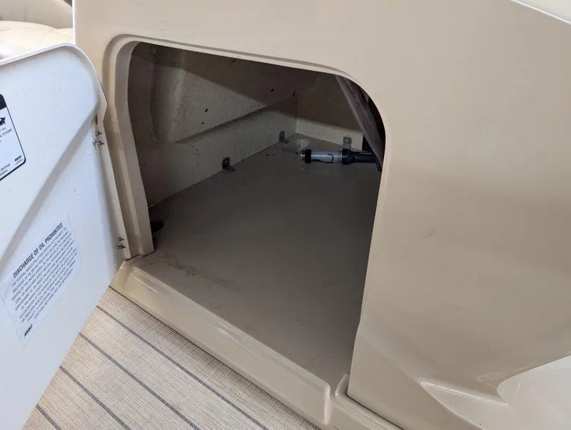 Slide: The Image of Open storage compartment on 2018 Sylvan Mirage Cruise 8524 Entertainer boat. - 17