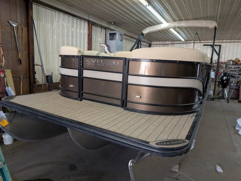 Slide: The Image of 2018 Sylvan Mirage Cruise 8524 Entertainer pontoon boat in a workshop setting. - 3
