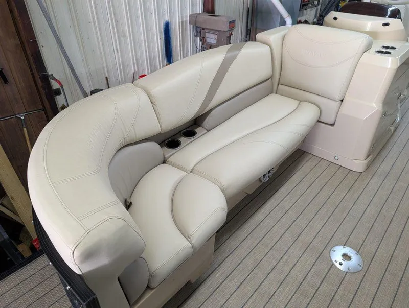 Slide: The Image of 2018 Sylvan Mirage Cruise 8524 Entertainer boat with beige seating and cup holders. - 4