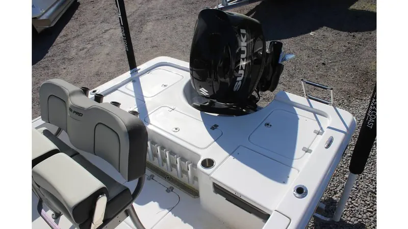 Slide: The Image of 2025 Sea Pro 230 Bay boat with Suzuki outboard motor, featuring spacious deck and seating. - 2