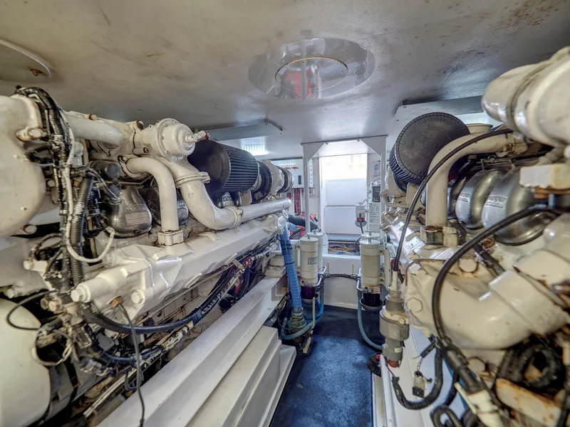 Slide: The Image of Engine room of a 2001 Viking Convertible yacht, showcasing dual powerful engines. - 34