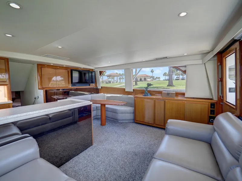 Slide: The Image of Luxurious interior of a 2001 Viking Convertible yacht with plush seating and modern amenities. - 4