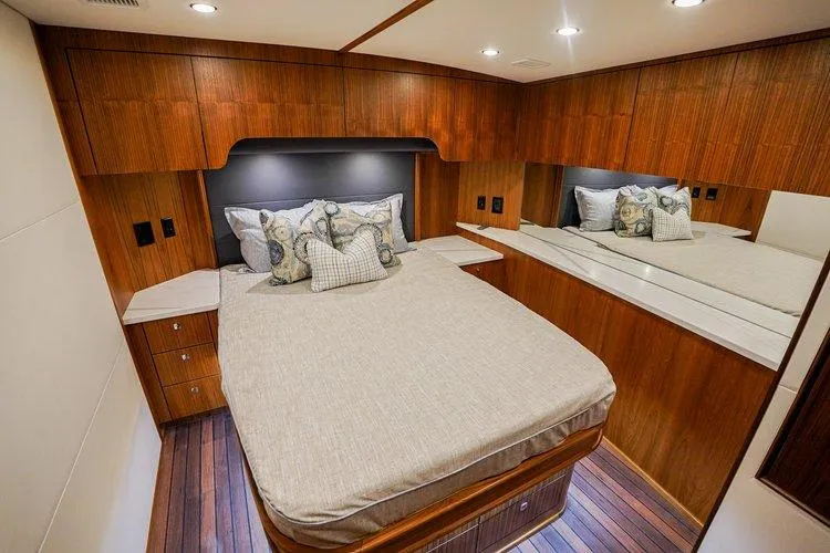 Slide: The Image of Luxurious cabin interior of 2024 Matthews 62 Sport Fish yacht with elegant wood finish. - 18