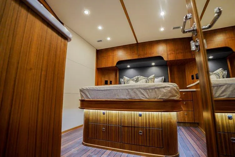 Slide: The Image of Luxurious cabin interior of 2024 Matthews 62 Sport Fish yacht with wooden finishes. - 19