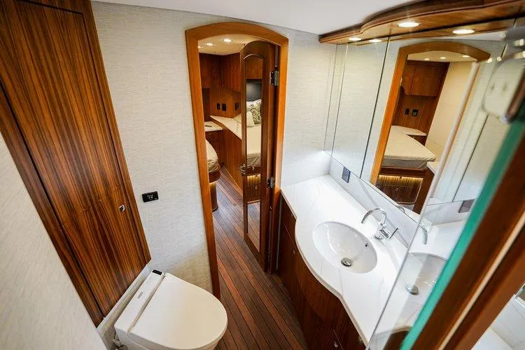 Slide: The Image of Luxurious bathroom interior of 2024 Matthews 62 Sport Fish yacht with wood accents. - 20