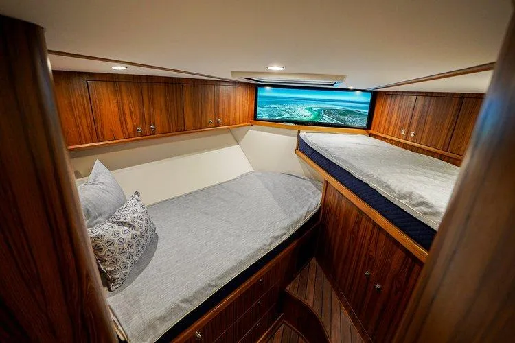 Slide: The Image of Luxurious cabin interior of 2024 Matthews 62 Sport Fish yacht with twin beds. - 22