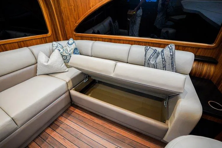 Slide: The Image of Luxurious interior of 2024 Matthews 62 Sport Fish yacht with hidden storage under seating. - 9