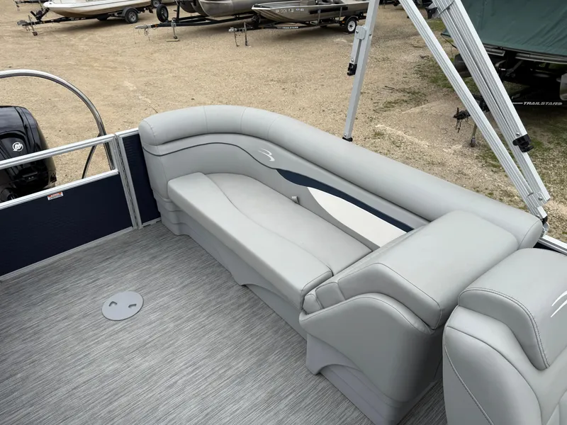 Slide: The Image of 2021 Bennington 22 SSR pontoon boat with gray seating and carpeted deck. - 19