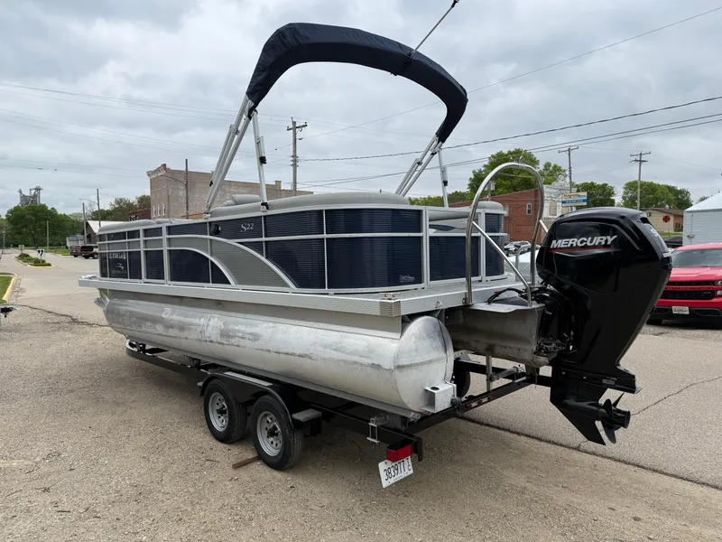 Slide: The Image of 2021 Bennington 22 SSR pontoon boat with Mercury engine on a trailer. - 5