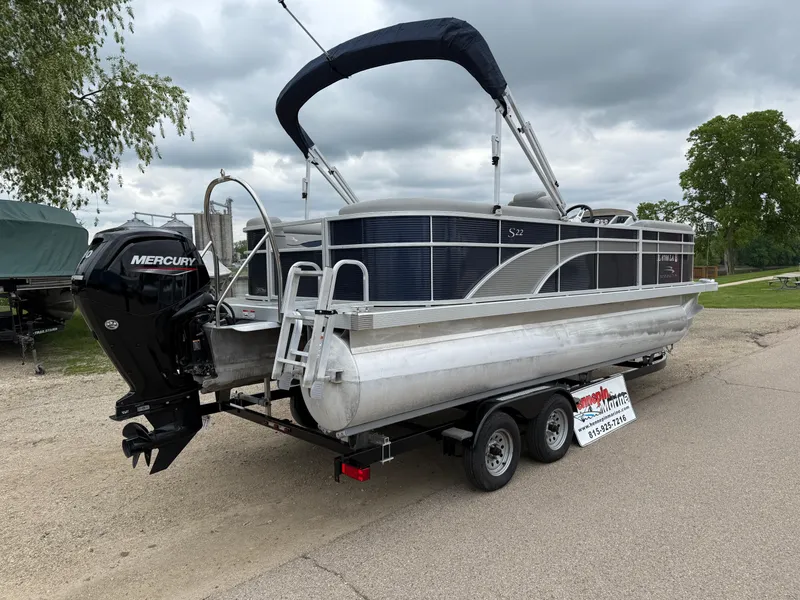 Slide: The Image of 2021 Bennington 22 SSR pontoon boat on trailer with Mercury outboard motor. - 7