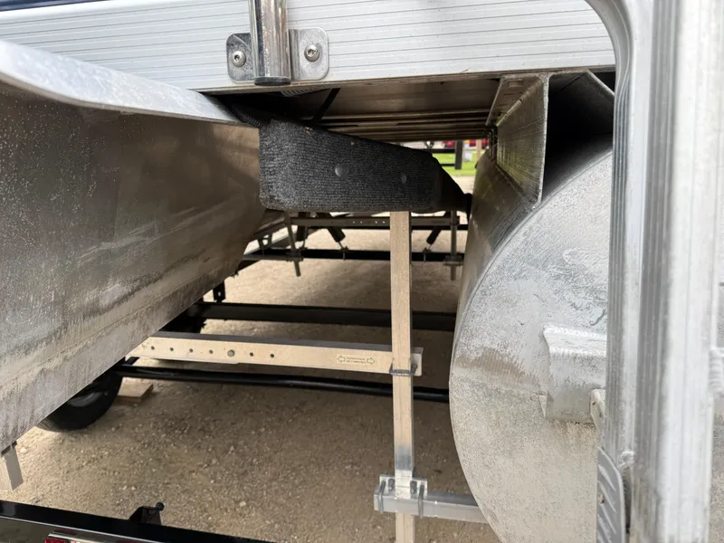 Slide: The Image of 2021 Bennington 22 SSR pontoon boat underside on trailer, showing pontoons and support structure. - 8