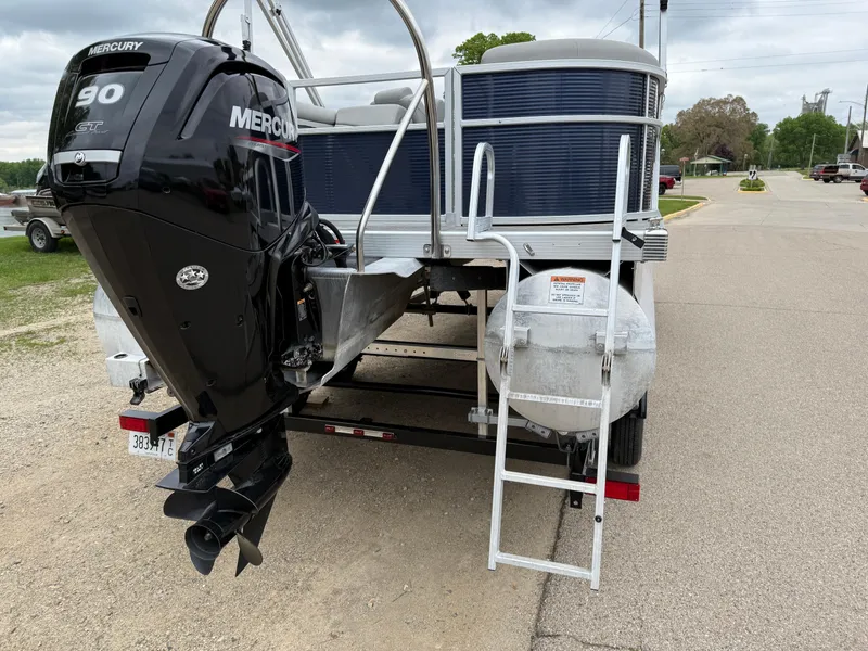 Slide: The Image of 2021 Bennington 22 SSR pontoon boat with Mercury 90 engine and rear ladder. - 9
