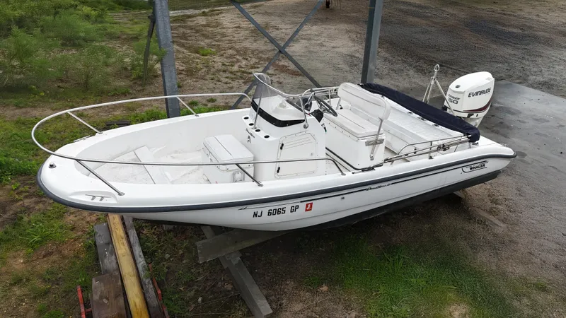 Slide: The Image of 2001 Boston Whaler DAUNTLESS boat on a trailer, viewed from above. - 0