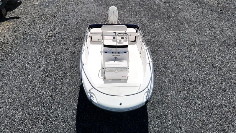 Slide: The Image of 2001 Boston Whaler DAUNTLESS boat on gravel surface, aerial view. - 2