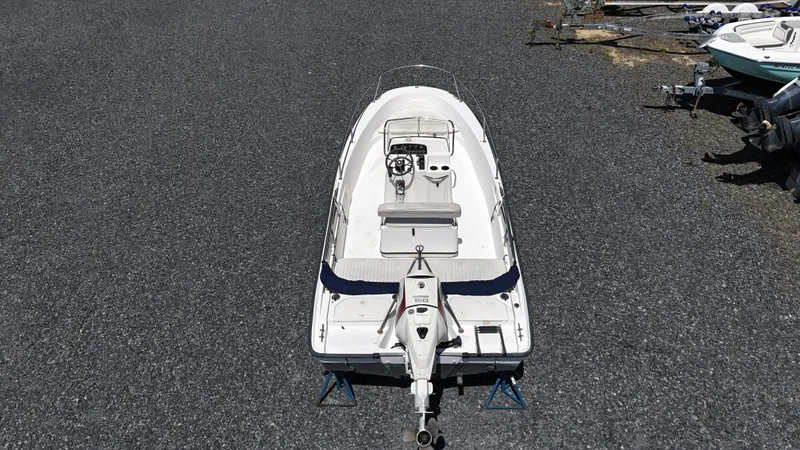 Slide: The Image of 2001 Boston Whaler DAUNTLESS boat on gravel, aerial view. - 8