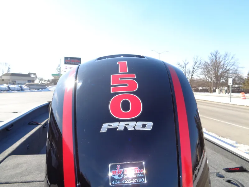 Slide: The Image of Outboard motor on 2025 Lund 1875 Impact XS SS boat, featuring "150 PRO" branding. - 18