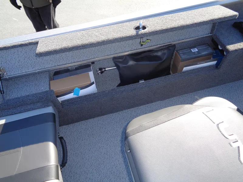 Slide: The Image of 2025 Lund 1875 Impact XS SS boat interior storage compartments. - 25