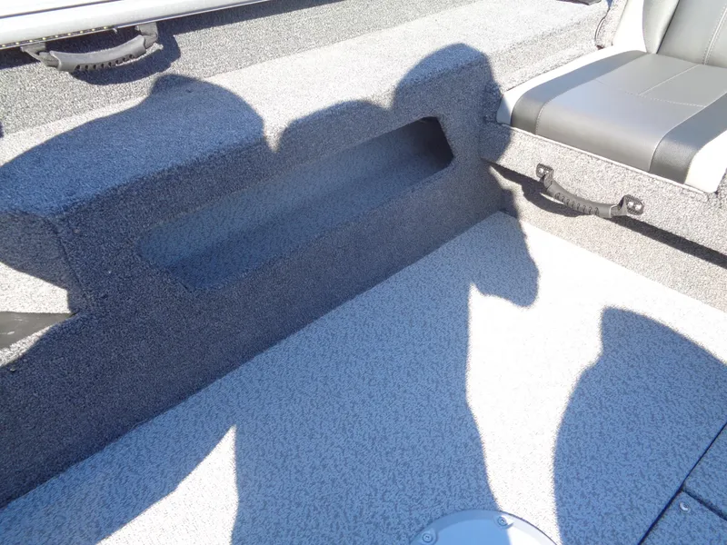 Slide: The Image of 2025 Lund 1875 Impact XS SS boat interior with seating and storage area. - 26