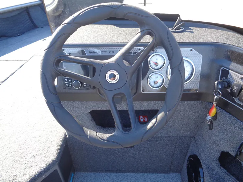 Slide: The Image of Steering wheel and dashboard of 2025 Lund 1875 Impact XS SS boat. - 28