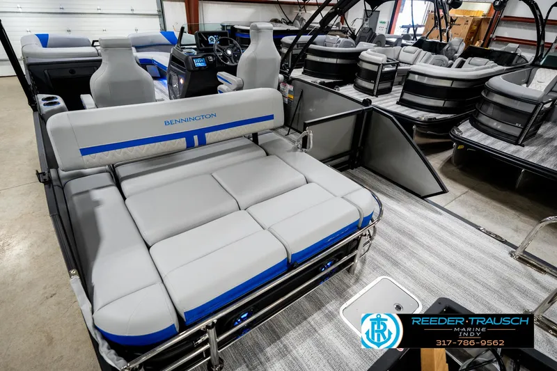Slide: The Image of 2025 Bennington 24 MSB pontoon boat interior with plush seating and modern design. - 15