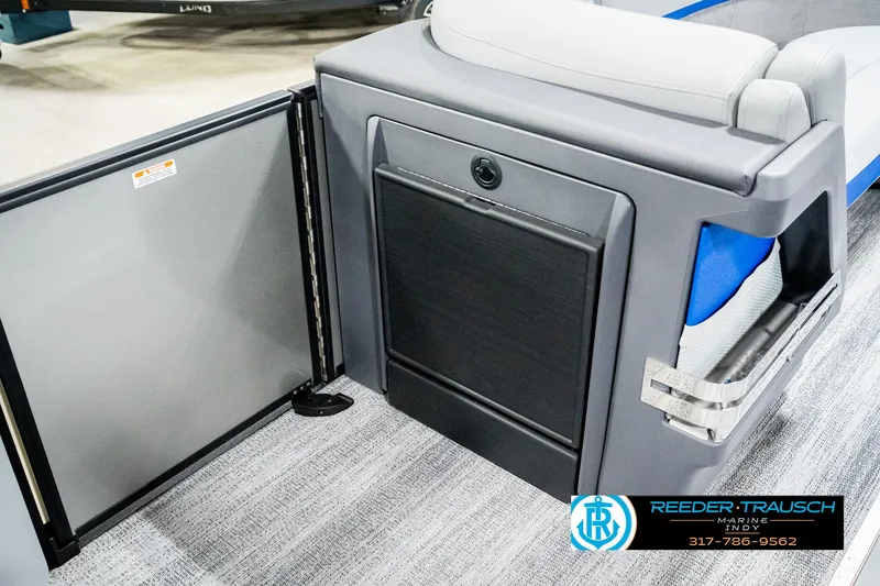 Slide: The Image of 2025 Bennington 24 MSB boat interior with sleek seating and storage compartment. - 24