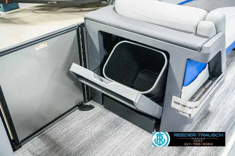 Slide: The Image of 2025 Bennington 24 MSB boat interior with storage compartment and seating. - 26