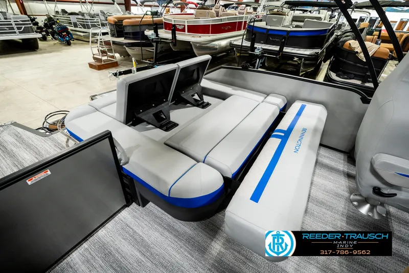 Slide: The Image of 2025 Bennington 24 MSB pontoon boat interior with modern seating and dual screens. - 29