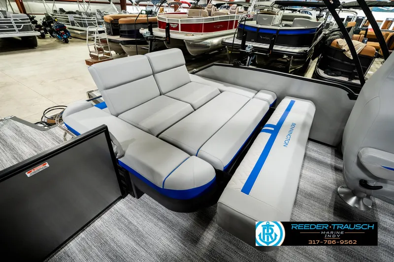 Slide: The Image of 2025 Bennington 24 MSB pontoon boat with luxurious seating in showroom. - 30
