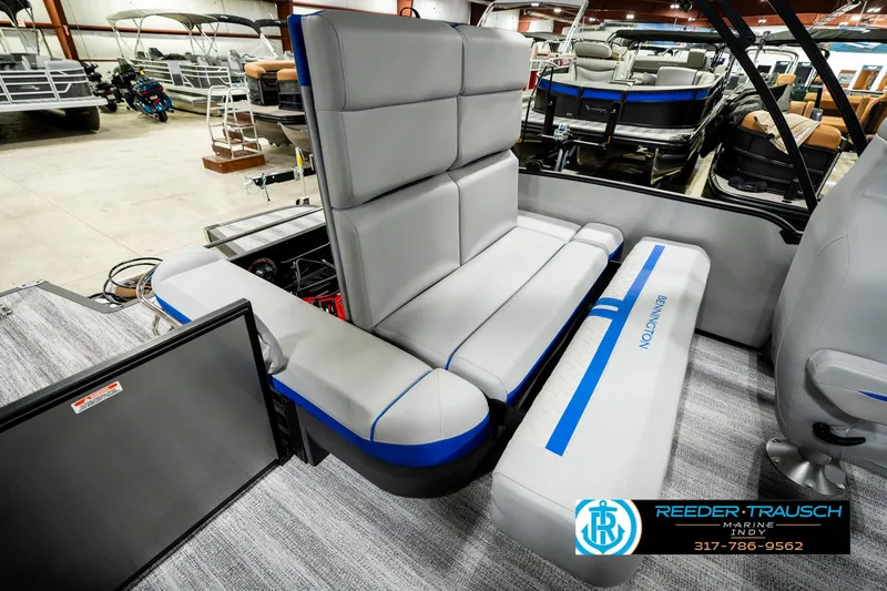 Slide: The Image of 2025 Bennington 24 MSB pontoon boat interior with gray seating and blue accents. - 31