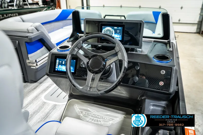 Slide: The Image of 2025 Bennington 24 MSB boat dashboard with modern controls and steering wheel. - 34