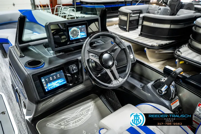 Slide: The Image of 2025 Bennington 24 MSB boat dashboard with modern controls and digital displays. - 35
