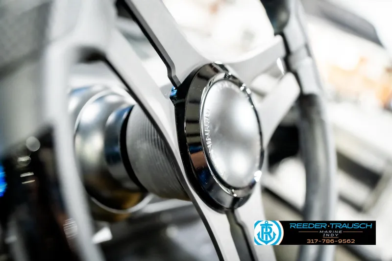 Slide: The Image of Steering wheel of 2025 Bennington 24 MSB boat, close-up view. - 36