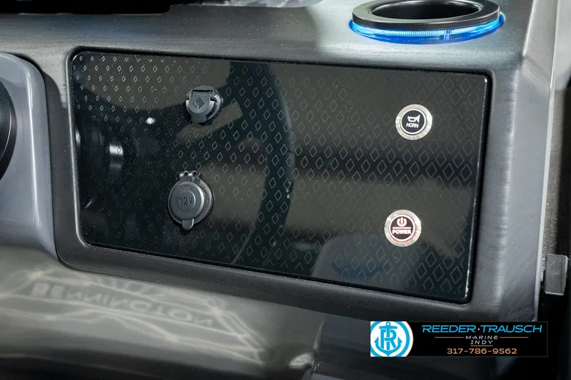 Slide: The Image of Dashboard of 2025 Bennington 24 MSB with control buttons and cup holder. - 40