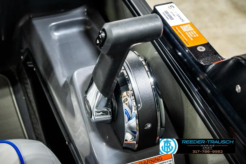 Slide: The Image of Throttle control of 2025 Bennington 24 MSB boat, featuring ergonomic design and chrome accents. - 41