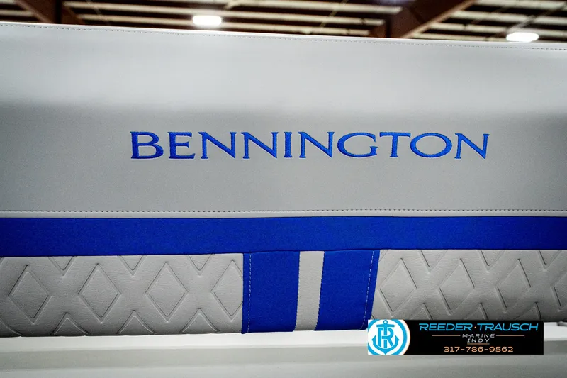 Slide: The Image of 2025 Bennington 24 MSB boat seat with blue and gray design, featuring Reeder-Trausch logo. - 44