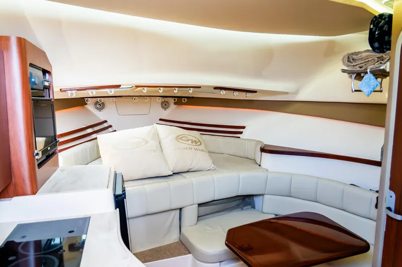 Slide: The Image of Interior of 2015 Grady-White 330 Express boat with cozy seating and modern amenities. - 4