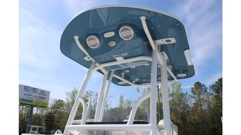 Slide: The Image of 2025 Sea Pro 210 boat with blue T-top and speakers, viewed from below. - 7