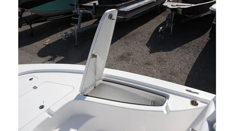 Slide: The Image of 2025 Sea Pro 210 boat storage compartment open, showcasing interior space. - 8