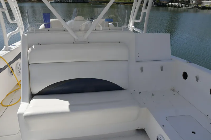 Slide: The Image of 2010 Deep Impact 36 TE boat interior with white seating and water view. - 11
