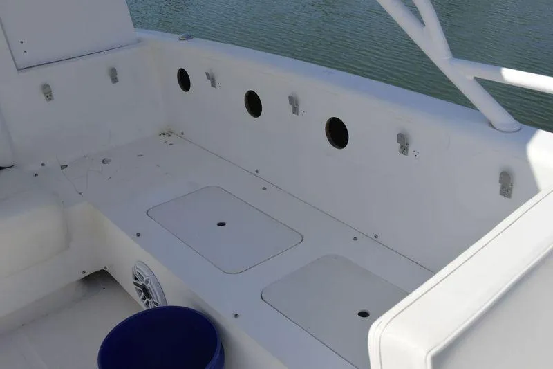 Slide: The Image of 2010 Deep Impact 36 TE boat interior with storage compartments and seating. - 12
