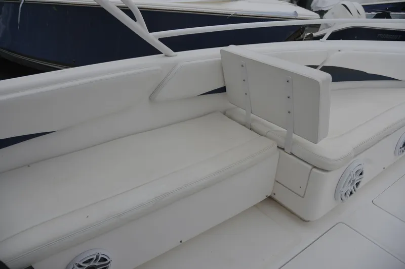 Slide: The Image of 2010 Deep Impact 36 TE boat interior with white seating and speaker system. - 13