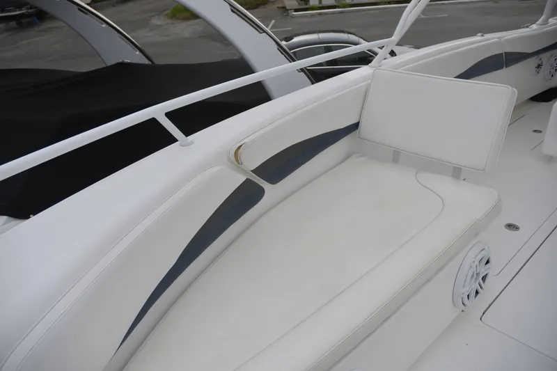 Slide: The Image of 2010 Deep Impact 36 TE boat with white cushioned seating and sleek design. - 15